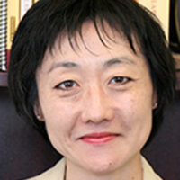 Headshot of an Asian woman with short dark hair